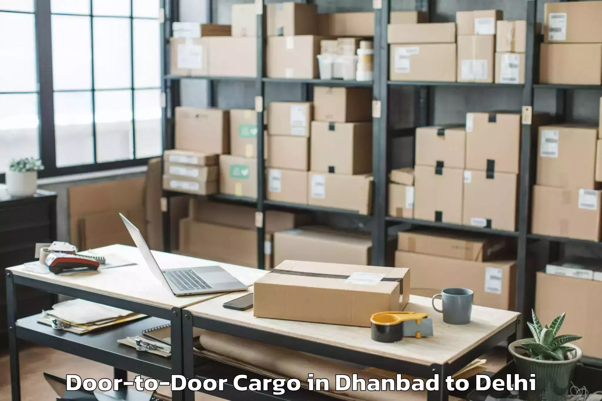 Get Dhanbad to Unity One Mall Rohini Door To Door Cargo